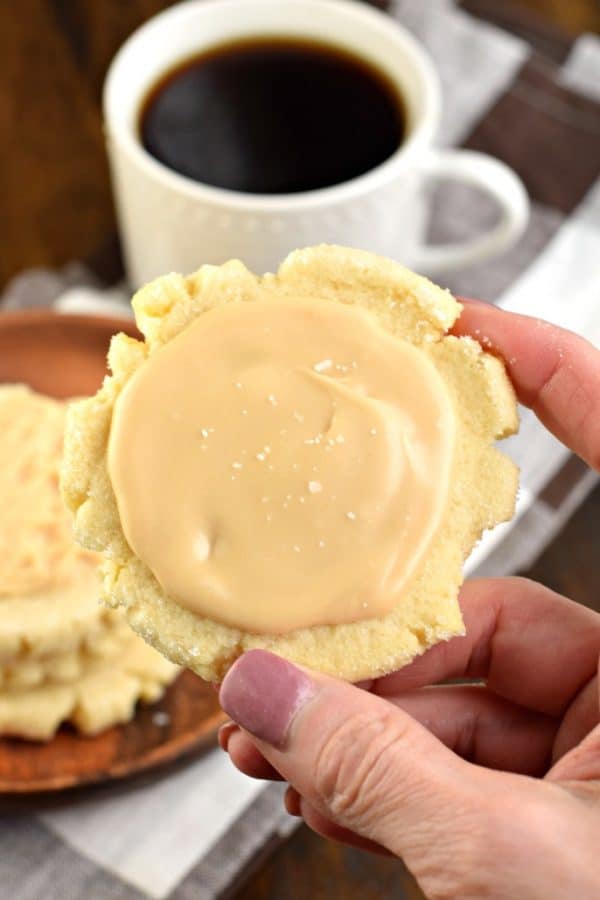 These Caramel Frosted Sugar Cookies are irresistible. Chewy sugar cookies with a no-chill dough topped with a sweet and salty caramel frosting!