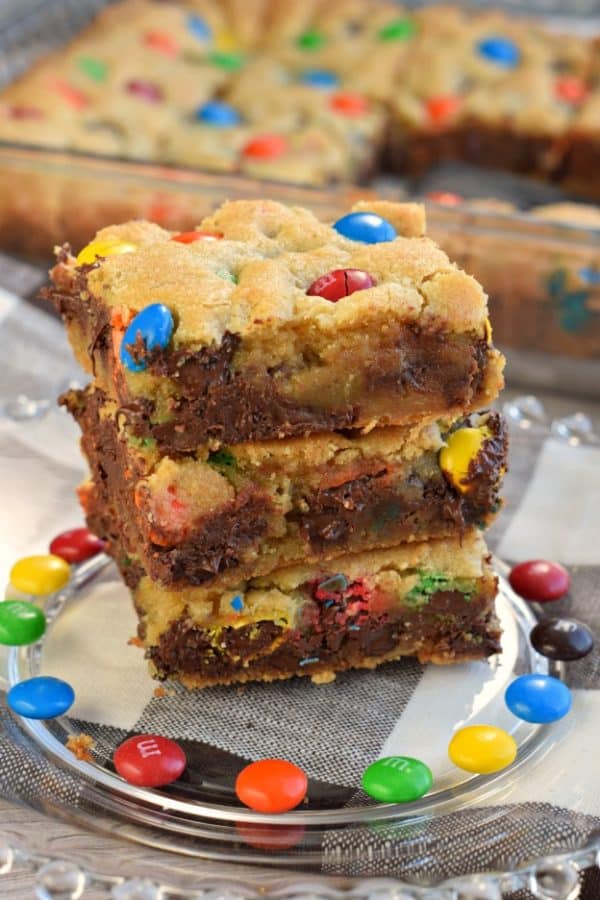 Chewy M&M's Chocolate Chip Cookie Bars are thick and delicious and perfect when you need a quick dessert. Perfect for holidays and bake sales too! Chewy M&M's Chocolate Chip Cookie Bars are thick and delicious and perfect when you need a quick dessert. Perfect for holidays and bake sales too!