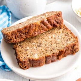 Two slices for banana bread recipe with toasted coconut.