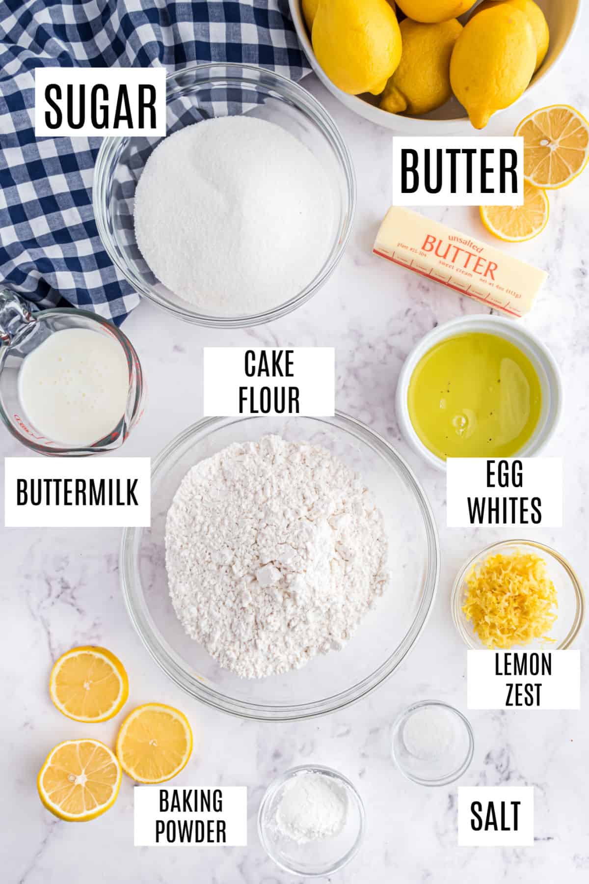 Ingredients needed to make homemade lemon cake with lemon curd filling.