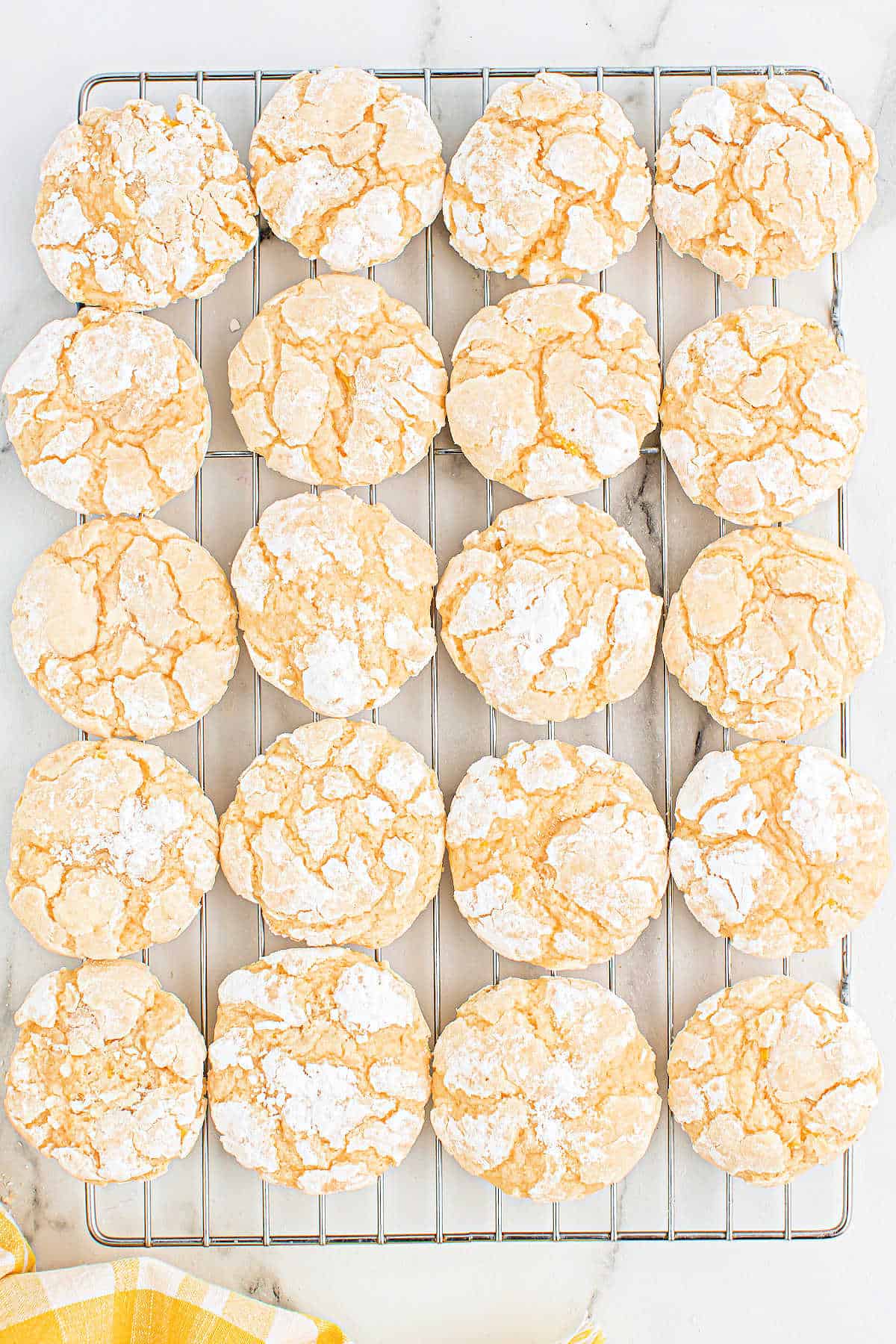 Lemon cookies on a wire cooling rack.