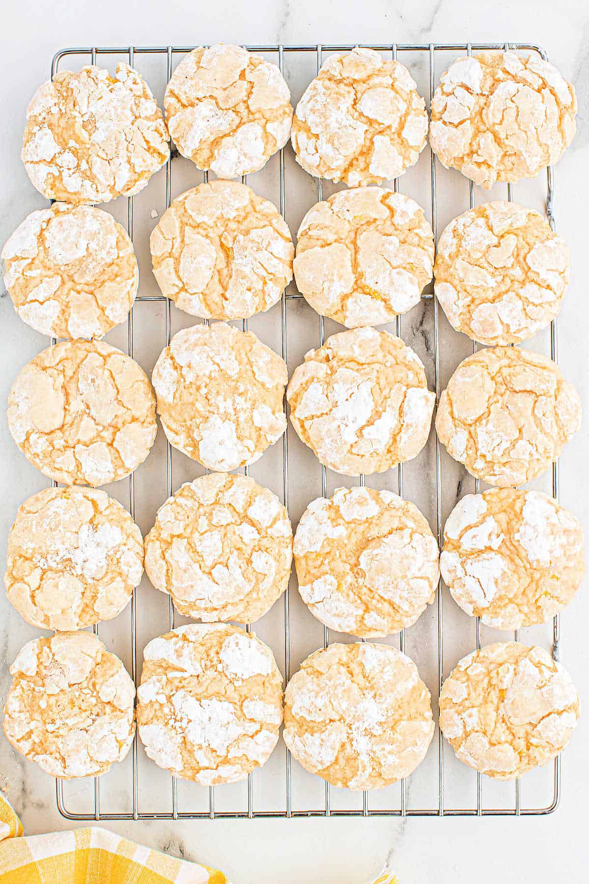 Lemon cookies on a wire cooling rack.