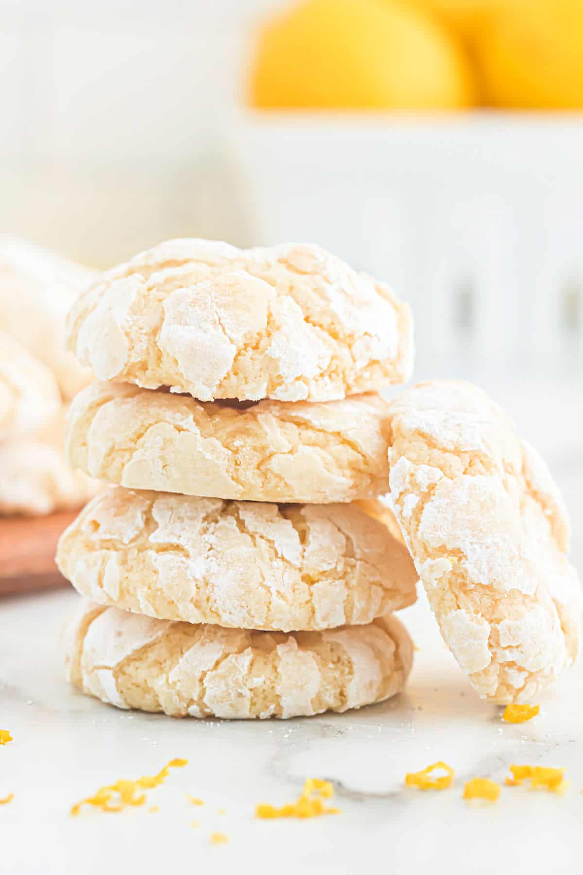 Gooey lemon cookies stacked on top of each other.