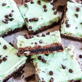 These thick and fudgy Mint Chocolate Chip Brownies are rich, decadent and refreshingly minty! The thick layer of mint chip buttercream frosting sets these brownies apart from the crowd.