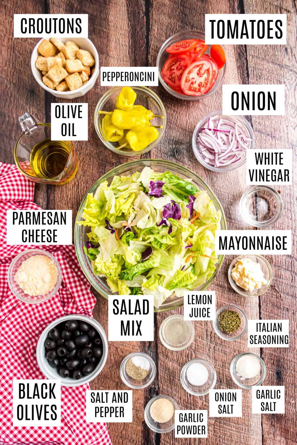 Ingredients needed to make olive garden salad at home.