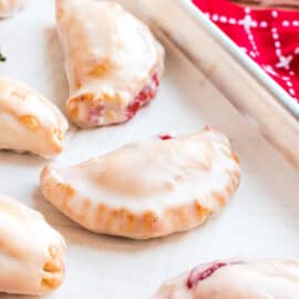 Strawberry Hand Pies are the perfect sweet treat to share with family and friends. This recipe is so easy, you'll want to make a double batch. We shaped some of them heart shaped, for Valentine's Day.