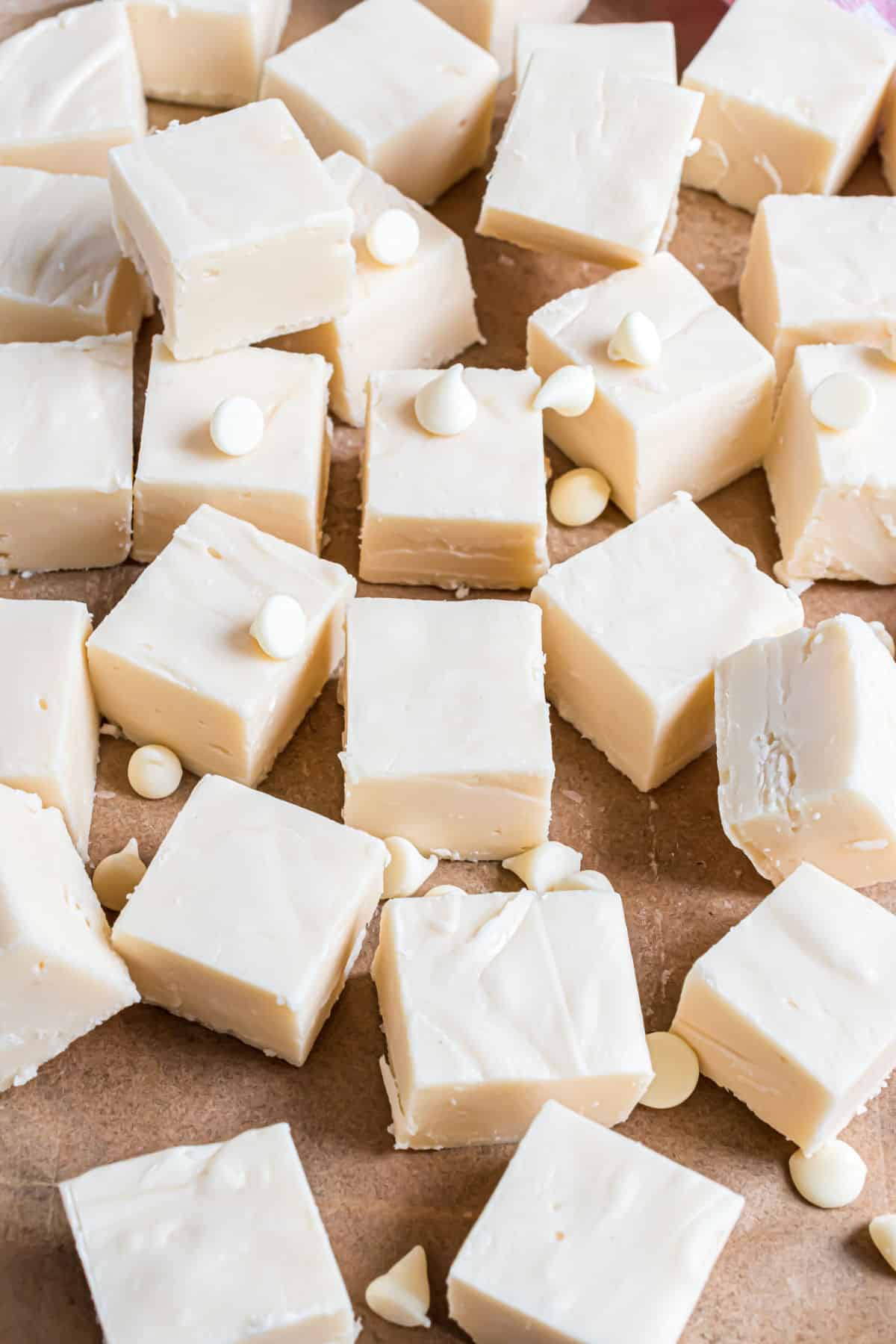 Vanilla fudge pieces on parchment paper.