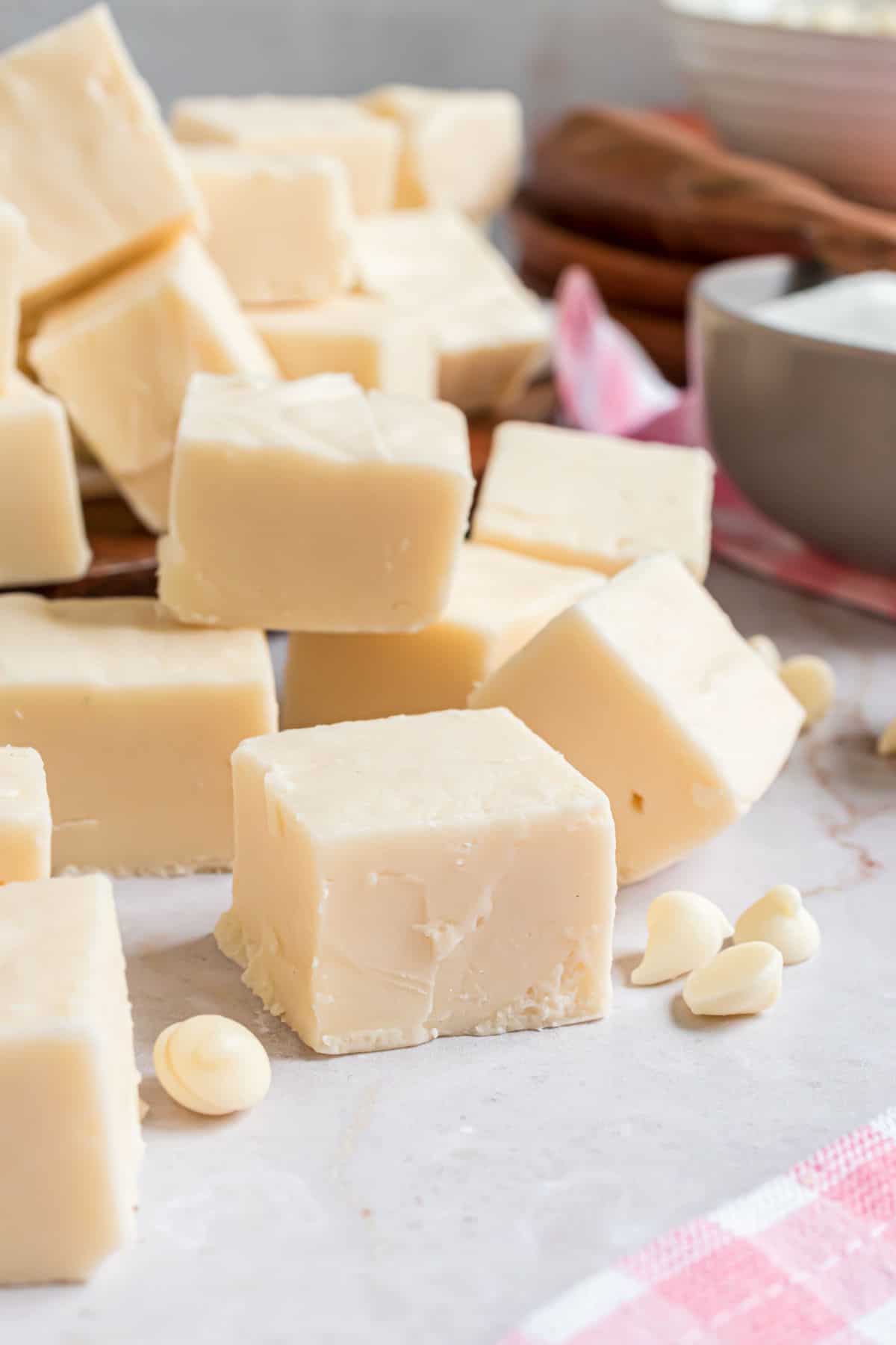 Vanilla fudge pieces stacked on top of eachother.