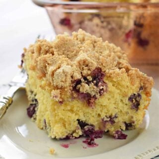 Tender and moist, this Blueberry Buckle Breakfast Cake recipe is the perfect start to your day. Packed with fresh berries and topped with a thick cinnamon streusel, you'll love a slice for breakfast or dessert!
