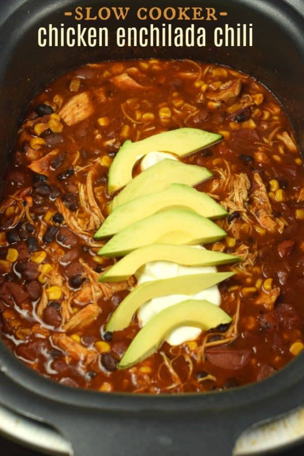 Hearty and flavorful, this fix it and forget it Slow Cooker Chicken Enchilada Chili recipe is delicious!