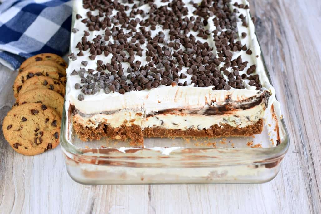 Baking dish with chocolate lasagna and several slices removed so you can see the layers.