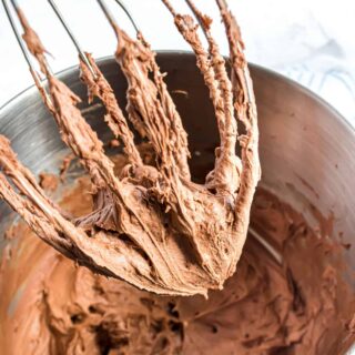 Chocolate frosting on a whisk.