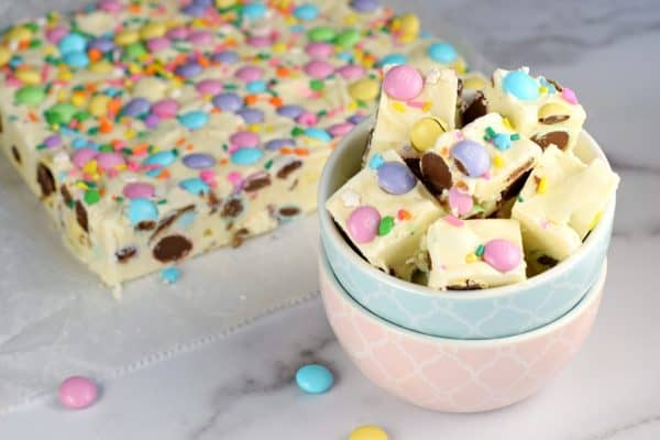 No matter the Spring holiday, this easy Easter Fudge recipe is perfect. Vanilla Fudge with pastel candies and sprinkles!