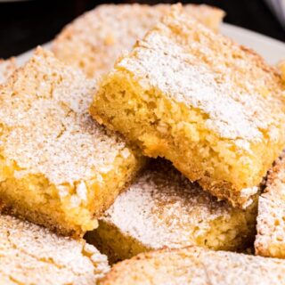 A St Louis tradition, this Gooey Butter Cake is simplified with it's easy cake mix option! Chewy Butter Cake crust with a gooey cream cheese filling!