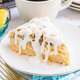 Lemon crumb coffee cake with lemon glaze drizzled over the top.