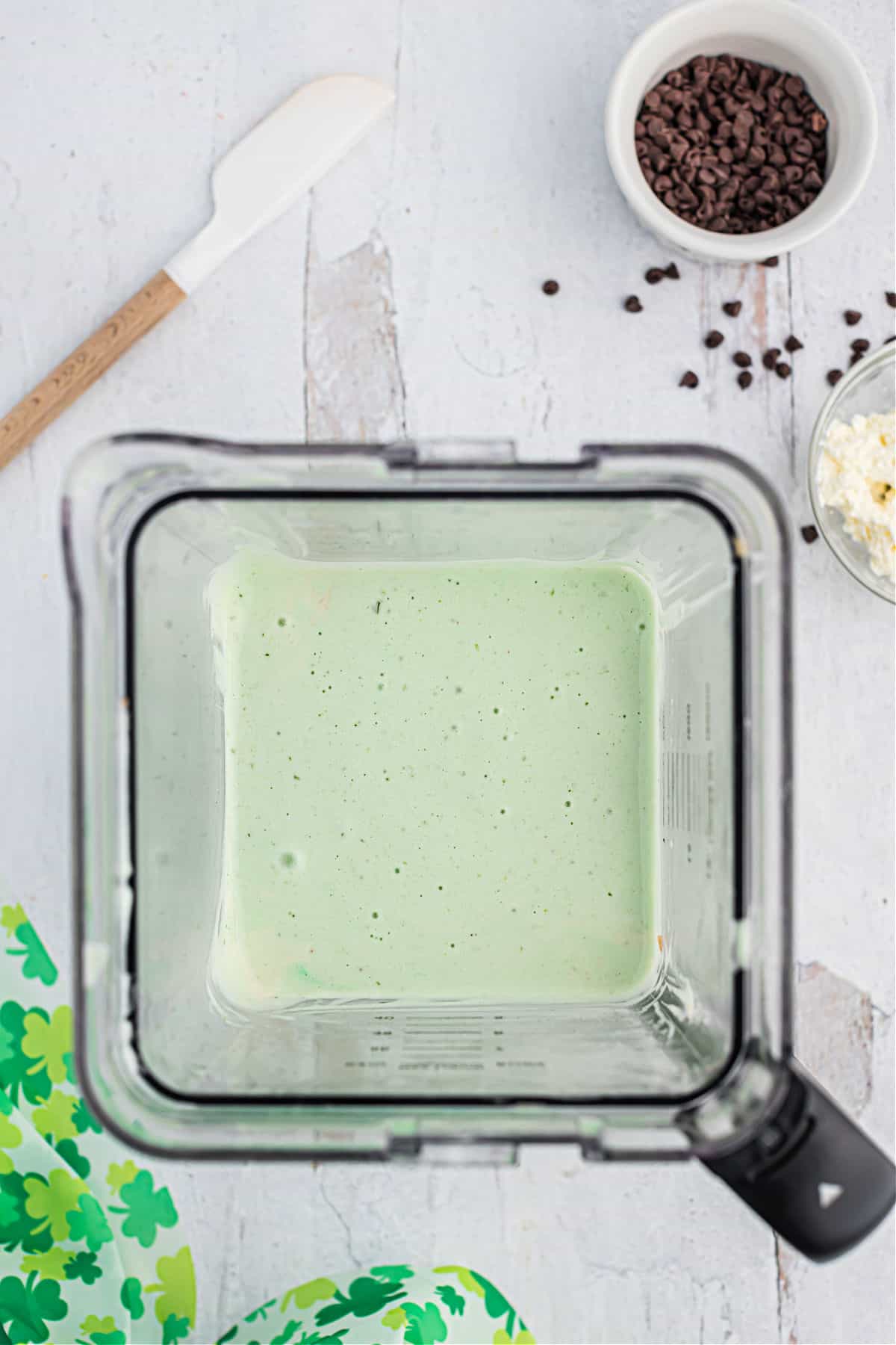 Blender with mint ice cream inside.