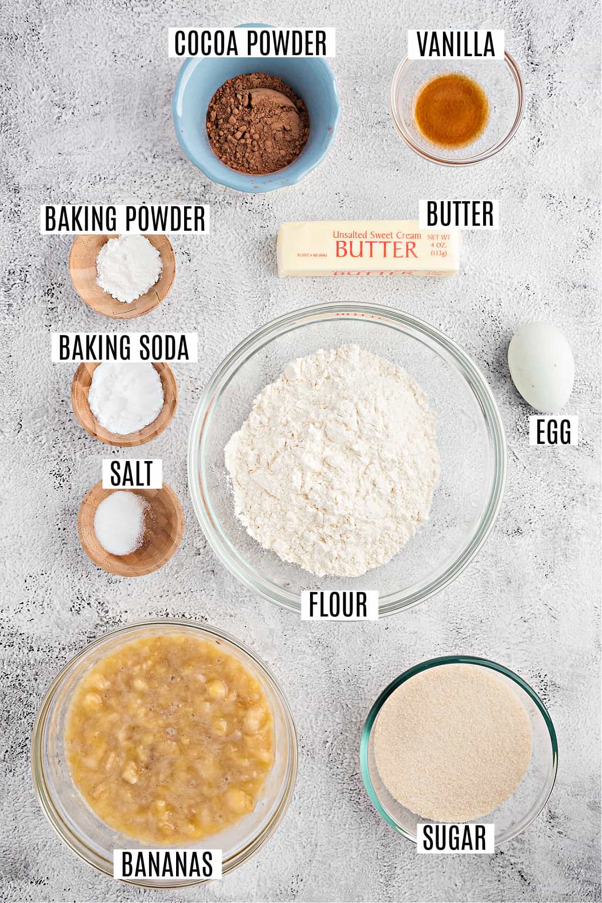 Ingredients needed to make chocolate banana muffins.