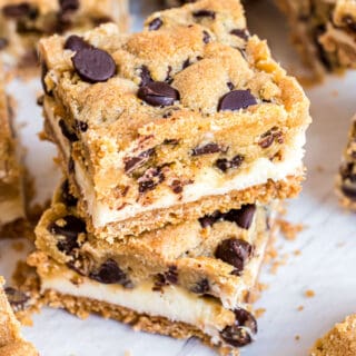 Chocolate Chip Cheesecake Bars with a graham cracker base, creamy cheesecake filling and delicious chocolate chip cookie crunch. These cold cookie bars are a perfect make ahead dessert!
