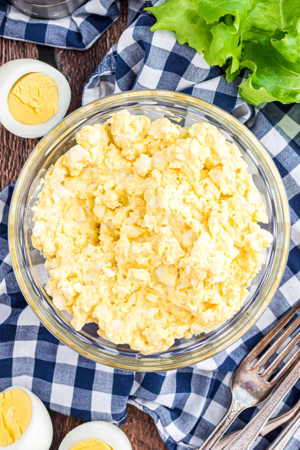 Egg salad in a clear glass bowl for serving.