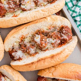 Meatball sub toasted with cheese.