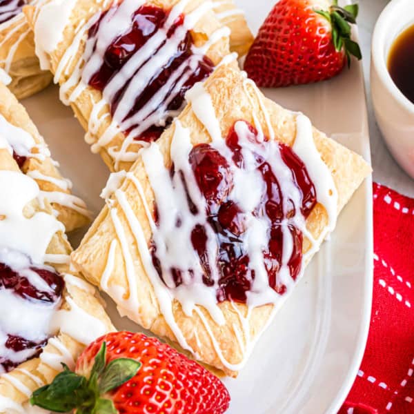 Puff pastry topped with pie filling and icing.