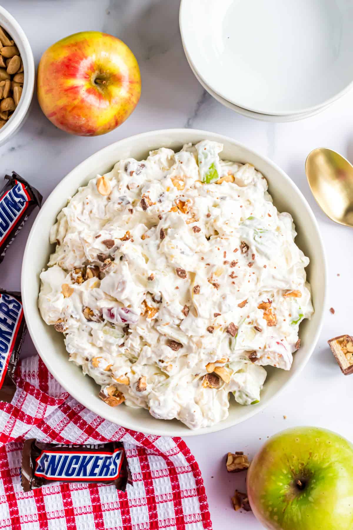 Snickers Salad in a white serving bowl.