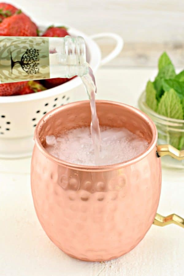 Strawberry Moscow Mule is the perfect, slightly spicy, summertime cocktail. You'll love how easy it is to make, but don't forget to serve your moscow mule in a copper mug!