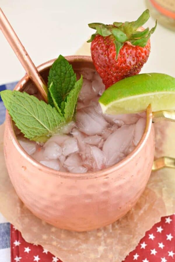 Strawberry Moscow Mule is the perfect, slightly spicy, summertime cocktail. You'll love how easy it is to make, but don't forget to serve your moscow mule in a copper mug!