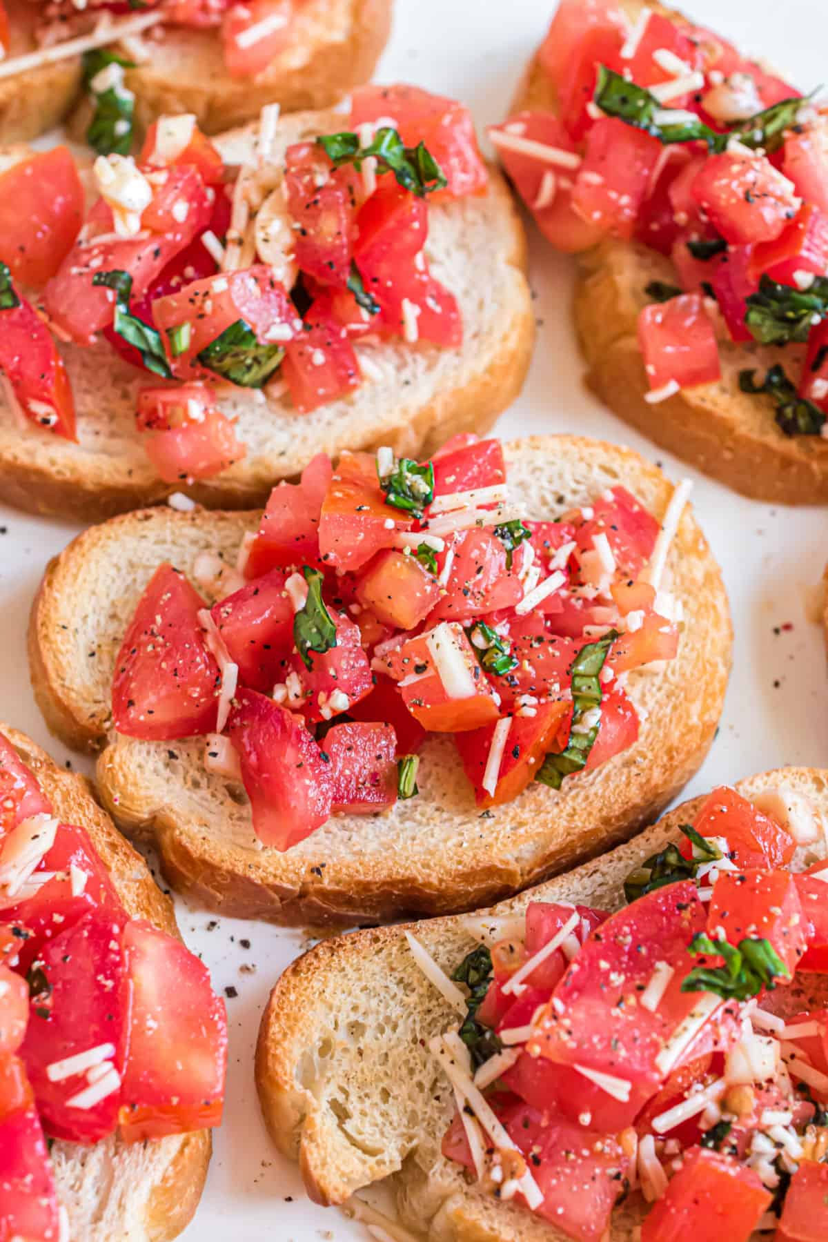 Bruschetta on small slices of toasted bread.