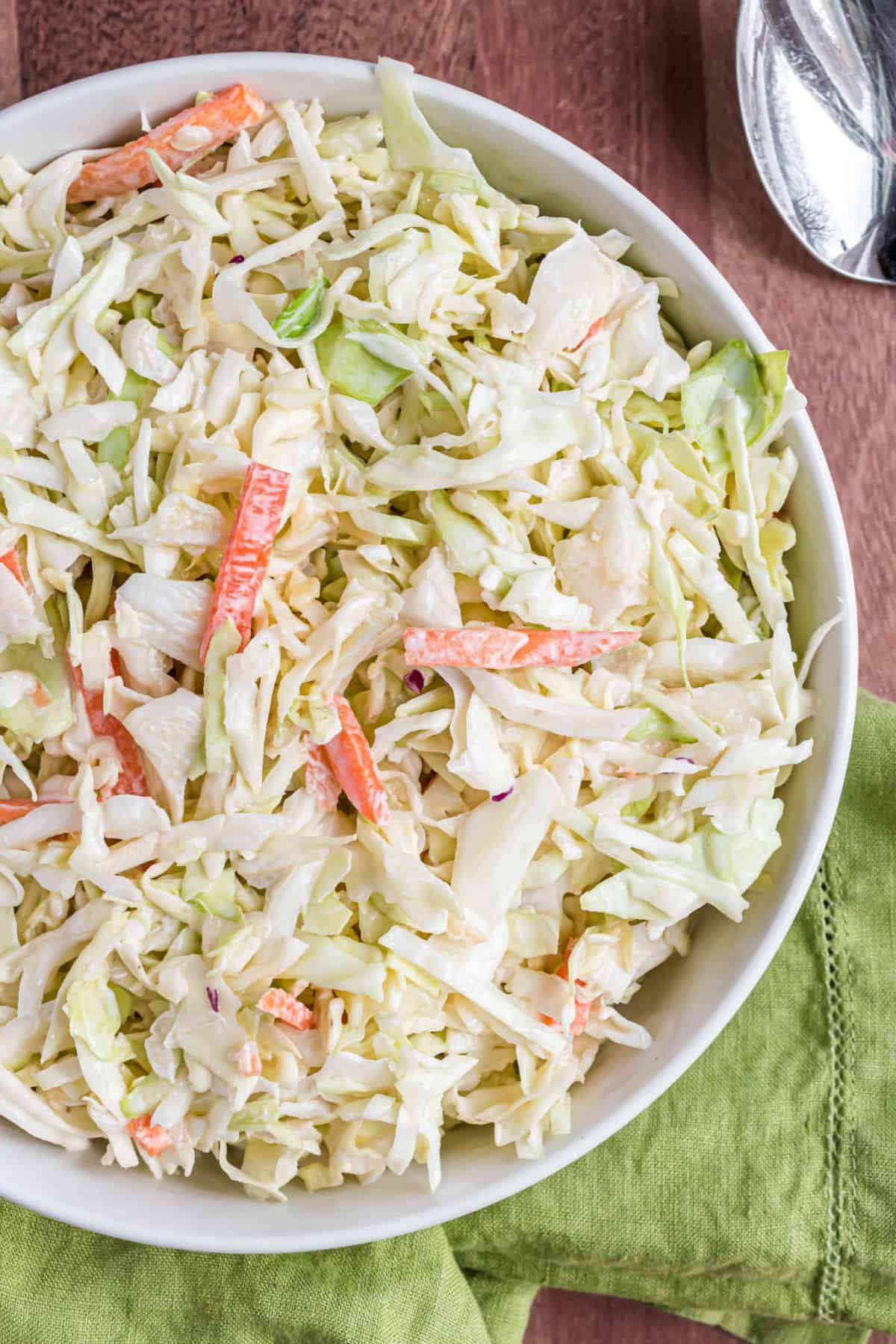 Coleslaw in a white bowl for serving.