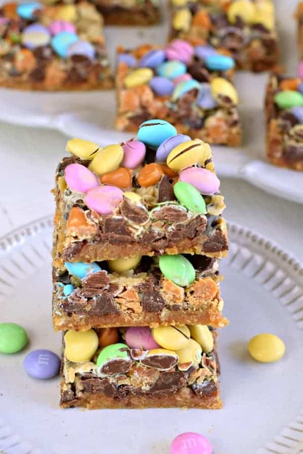 The BEST, Easy Magic Cookie Bars recipe is now at your fingertips. You'll love this 7 layer, chewy treat, that's so versatile for holidays or any day!