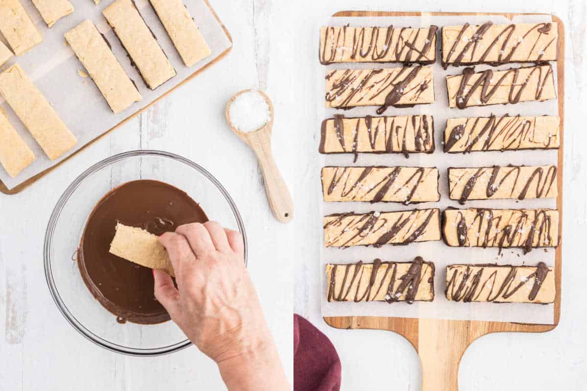 Hand dipping dark chocolate peanut butter shortbread cookies into chocolate; finished bars with chocolate drizzle on a wooden board and tray.