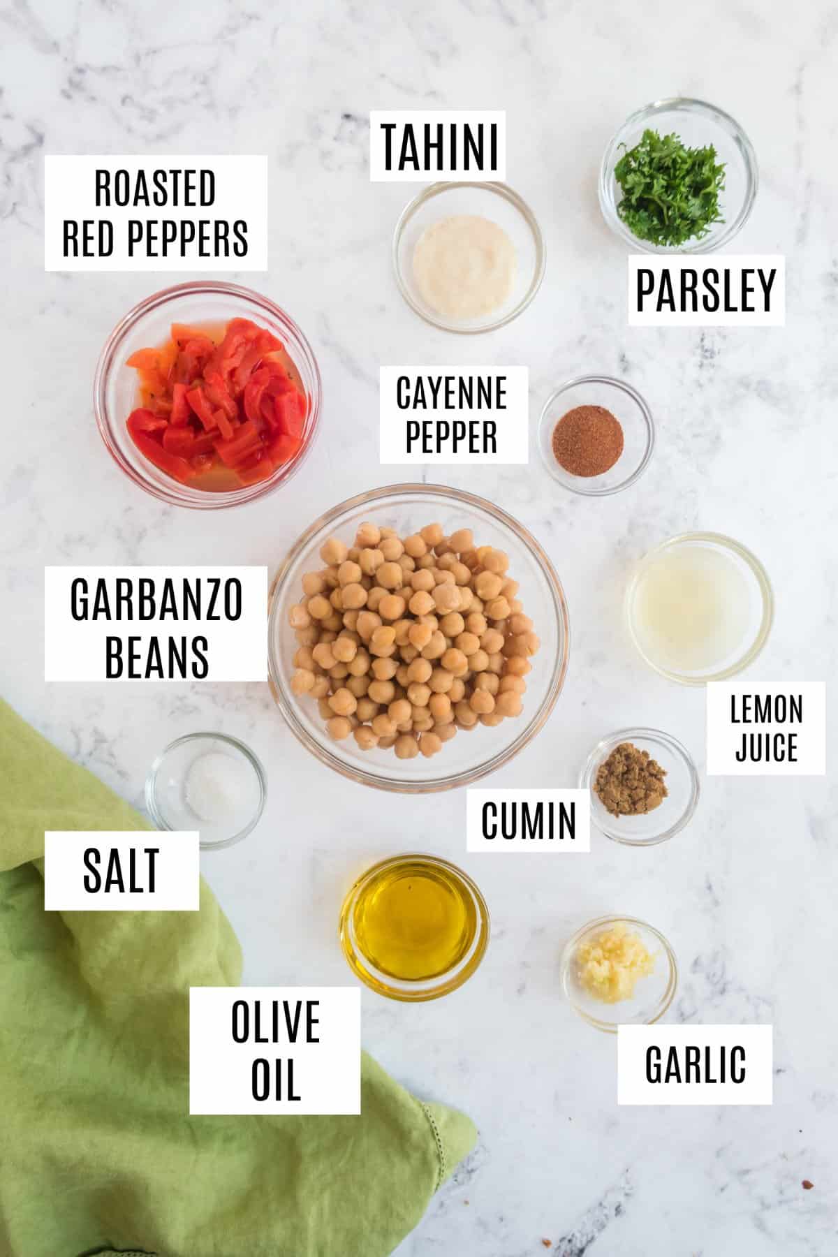 Ingredients needed to make roasted red pepper hummus.