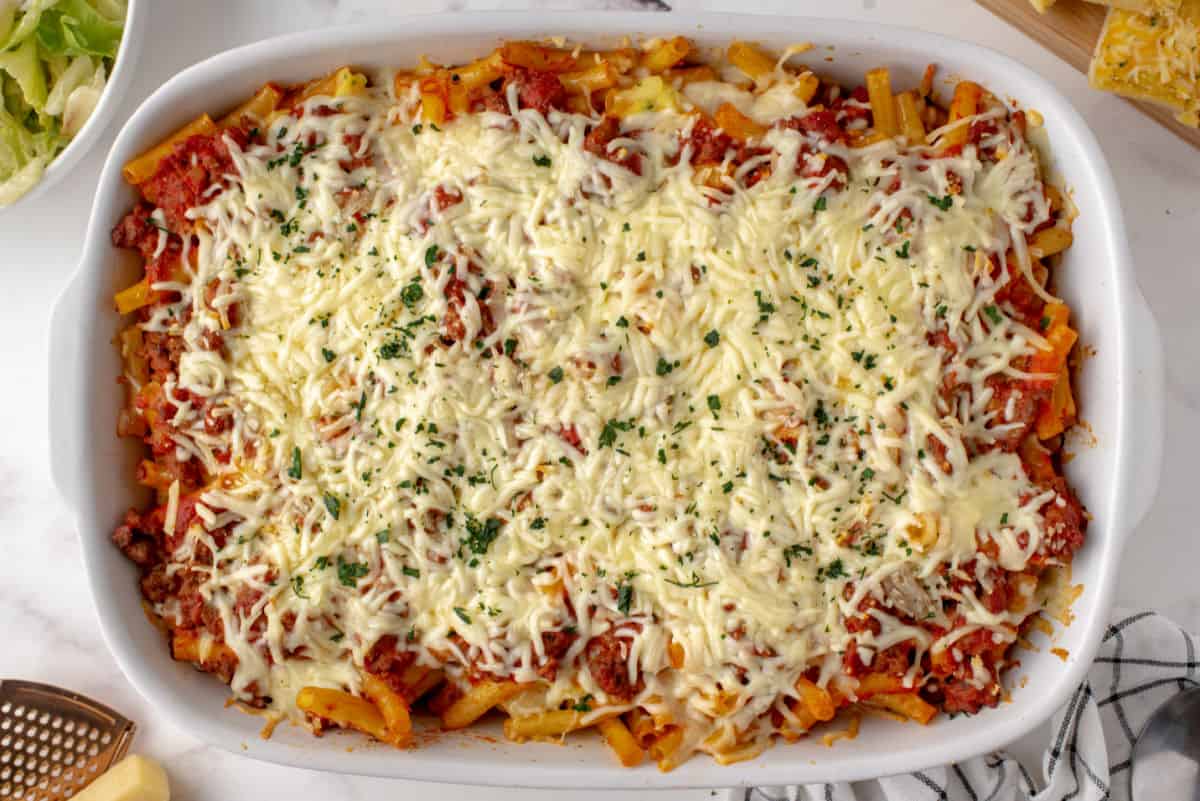 Baked ziti with cheese in a 13x9 baking dish.