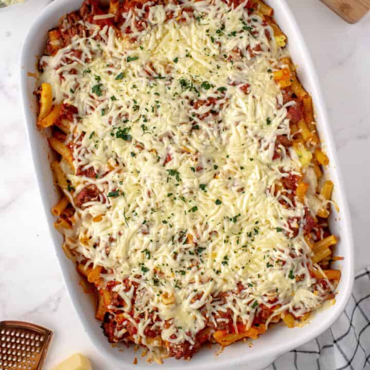 This easy, hearty Baked Ziti recipe has all the delicious layers of your favorite Italian dish. Perfect crowd pleaser, you'll love the hearty sauce and cheesy filling!