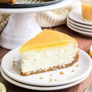 Classic Lemon Cheesecake tastes even better when it's topped with homemade lemon curd. Creamy and sweet with a bright lemon flavor, this cheesecake tastes like a slice of sunshine!