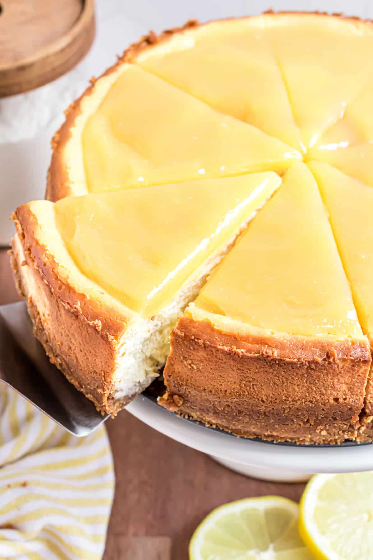 Cheesecake topped with lemon curd and cut into 8 large slices.