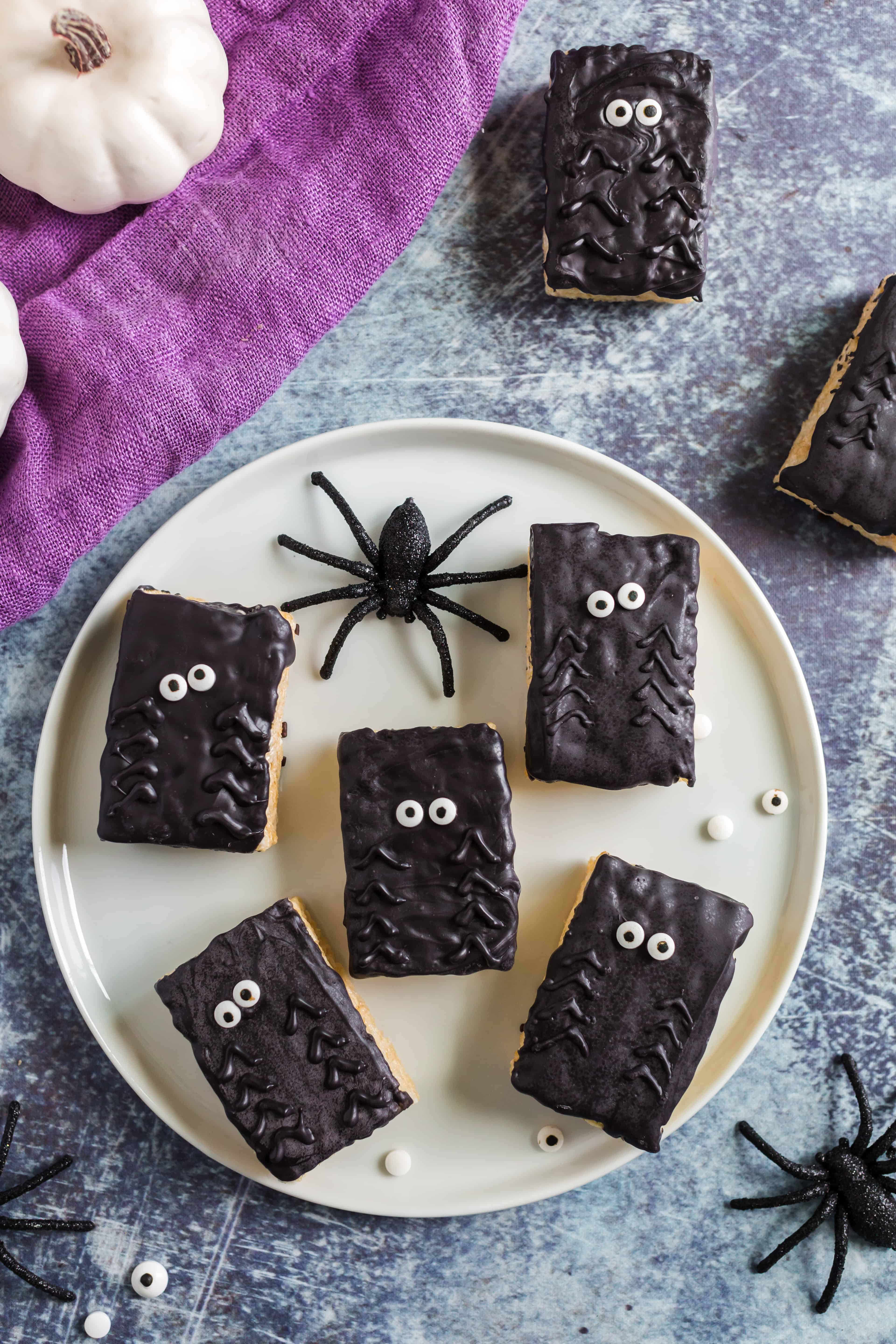 Plate of 5 halloween spider rice krispie treats.