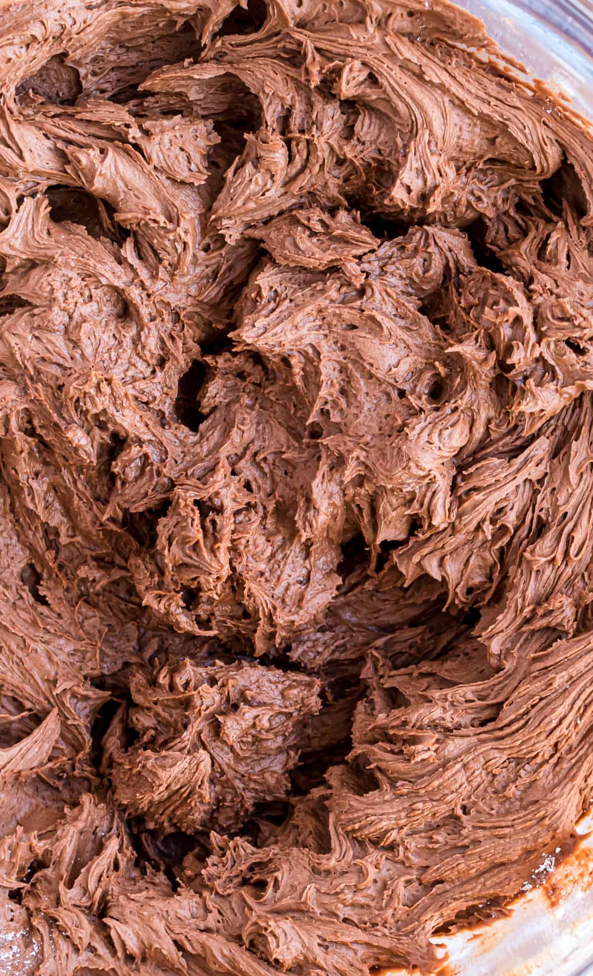 Close up photo of chocolate buttercream frosting.