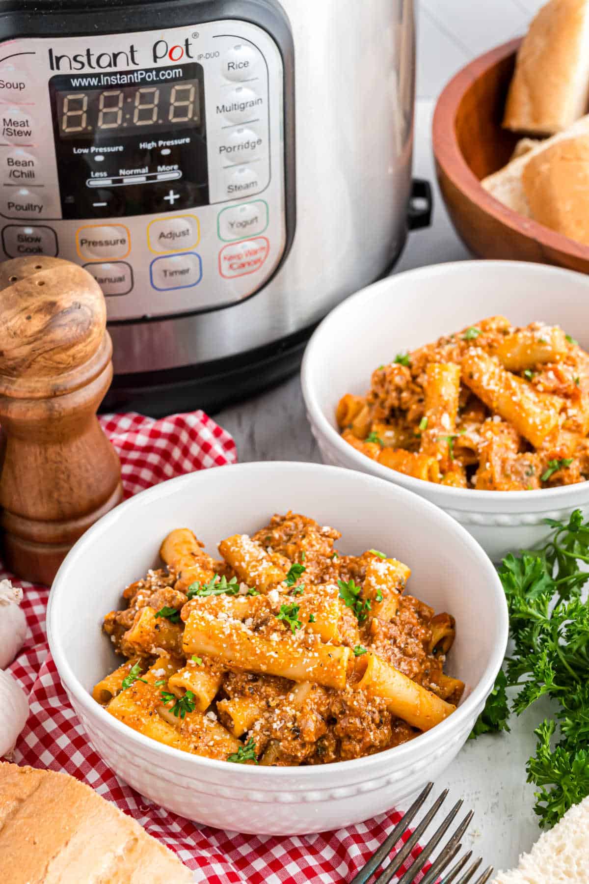 Ziti served in a white dinner bowl.