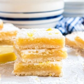 If you're looking for the best Lemon Bars with shortbread crust, this one is it. Easy cookie crust with a sweet and tangy lemon filling and lemon glaze, topped with powdered sugar!