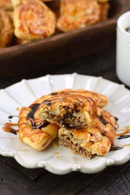 Mini Pecan Pies, or Pecan Hand Pies, are the perfect Thanksgiving dessert recipe. Freezer friendly and easy to make, your family will LOVE these treats.