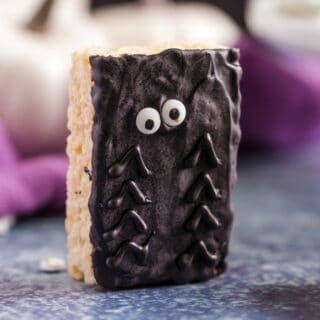 Halloween rice krispie treat with chocolate and candy eyes to represent a spider.