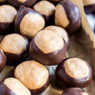 You don't have to be from Ohio to love Peanut Butter Buckeyes. These homemade candies have a soft peanut butter filling surrounded by rich chocolate. They're easy to make and always a hit!