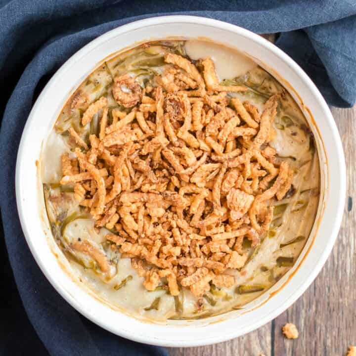 Green bean casserole in a white circle baking dish.