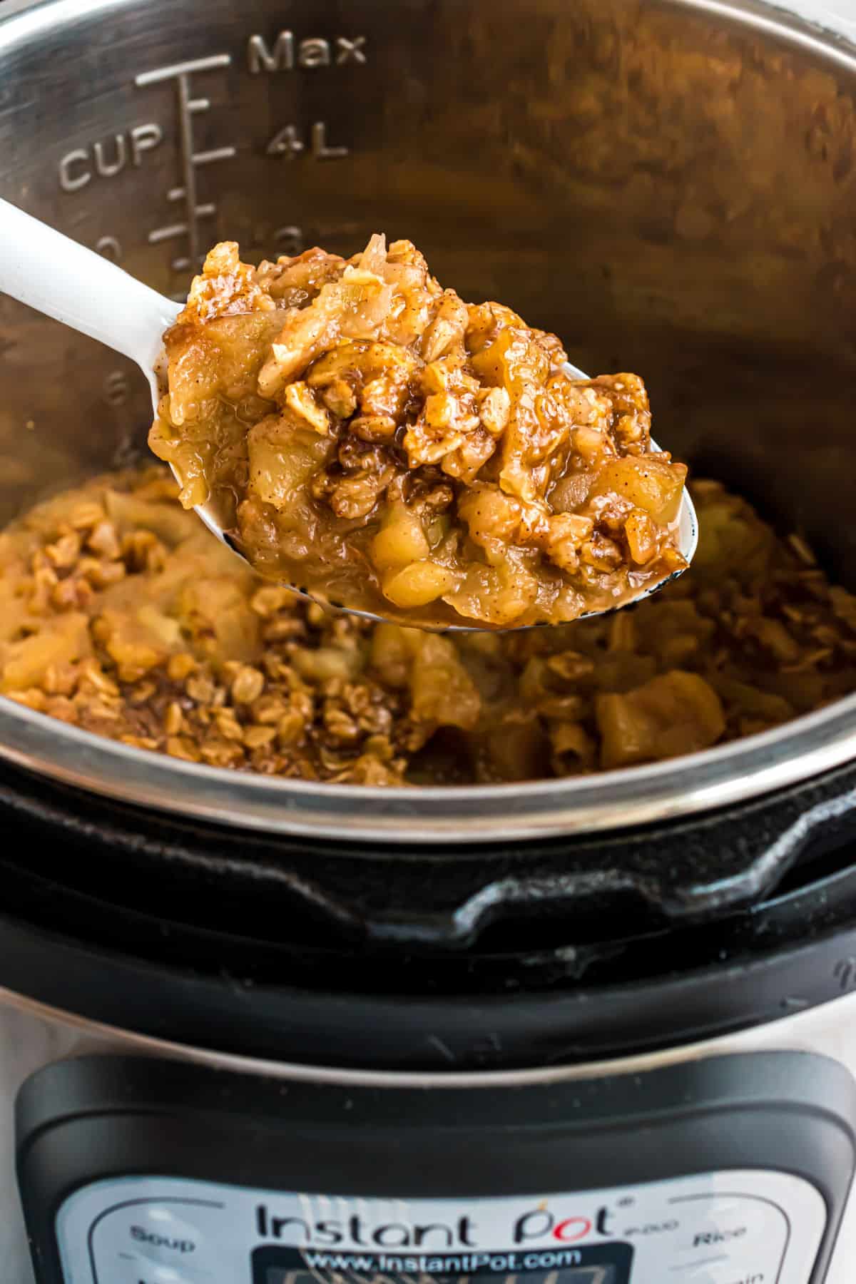 Apple crisp spooned out of an Instant Pot.