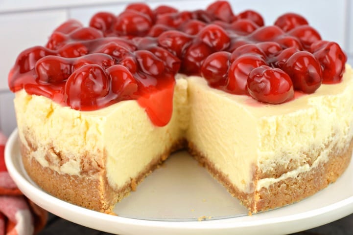 Instant Pot Cheesecake with cherry pie filling on top.