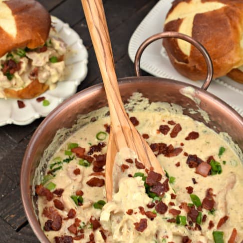 Crack chicken in skillet with wooden spoon to serve.