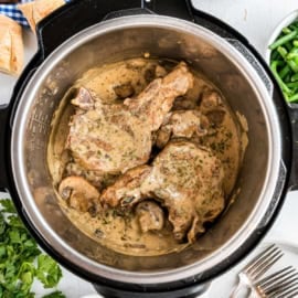 Juicy, fork tender Instant Pot Pork Chops with delicious Mushroom gravy recipe! You'll love this easy weeknight dinner recipe!