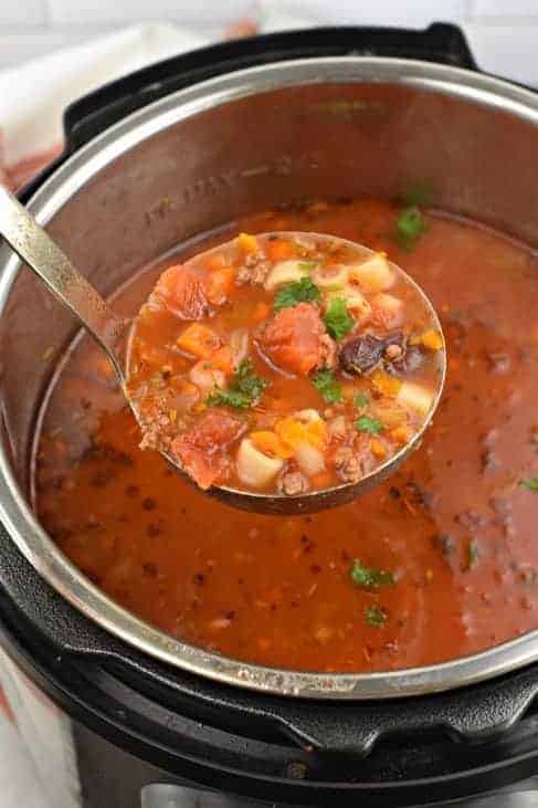 Ladle of Pasta e Fagioli soup in Instant Pot